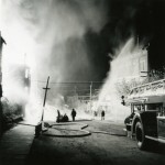 Fighting the Strathcona fire – Note the hosing down of the Legion building opposite.
