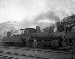 A locomotive of the hated CPR with the Hall Mines Smelter in the background.